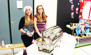 Herb Campbell alumni Kelsey Dale and Sarah McGonigal were helping to serve breakfast last Saturday.