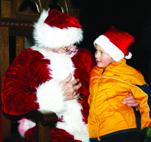 Santa Claus put in an appearance and lots of young folks like Sava Zarifopoulos, 7, got the chance to meet him.