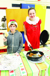 Grade 8 students William Wootton and Kady Wellman were helping to serve the food at the breakfast.