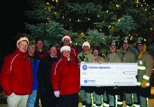 The festivities included the presentation of this cheque for $200 to the Caledon village firefighters from the Caledon Optimists. Paul Reder, Eric Mileham, Jake Haines, David Lambert, Ted Simmonds and Sue Montgomery made the presentation to Melinda Elen, Sandra Graham, Brandon Quirk, Ryan East and Eric Brown.
