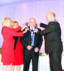Mississauga Mayor Bonnie Crombie, Brampton Mayor Linda Jeffrey and Caledon Mayor Allan Thompson placed the Chain of Office on Frank Dale.
