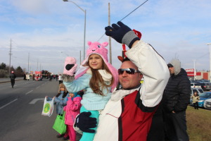 Selina Vilaca, 3, and her father Paul were waving at Santa as he passed by.