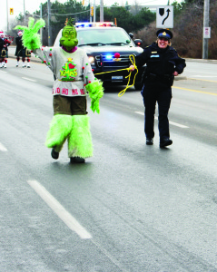 Caledon OPP acting Sergeant Brenda Evans was in charge of getting the Grinch through the parade.