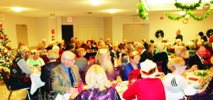 There was packed house on hand recently for the annual Christmas Dinner at the Caledon Seniors' Centre. Centre President Nora Martin extended the welcome to the gathering. Photos by Bill Rea