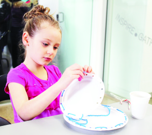 The activities included crafts. Andie Walker, 6, of Erin was working on her snowman creation. Photos by Bill Rea