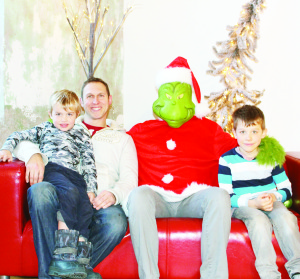 YOU'RE A FRIENDLY ONE, MR. GRINCH Families at Alton Mill have had the chance over the last couple of weekends to meet with the Grinch. Tom Mahoney of Erin and his sons Emmerson, 5, and Marcus, 7, took advantage of the opportunity. Photo by Bill Rea