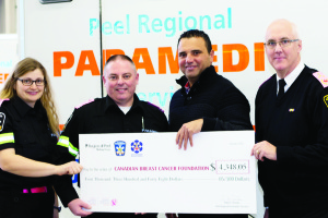 PARAMEDICS HELP FIGHT BREAST CANCER Peel Region Paramedics donated $4,348.05 to the Canadian Breast Cancer Foundation (CBCF) Jan. 7. Proceeds were raised through the sale of pink epaulettes that paramedics wore throughout October in support of breast cancer awareness month and CBCF's goal of creating a future without breast cancer. Seen here are Paramedic Kaley Jevnikar, Paramedic Jody Kernichan, CBCF's Vice-President of Development Anthony Miceli and Peel Regional Paramedic Services Chief Peter Dundas.