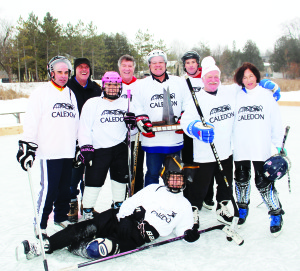The sixth annual Millpond Classic took place on the ponds at Alton Mill and Millcroft Inn Saturday, with proceeds going to the Alton Millpond Rehabilitation. The highlight was the game between the Caledon Notables against representatives to the Alton business community. The Notables won 8-5. The team members lined up behind Town Crier Andrew Welch for the trophy presentation were Caledon OPP Inspector Tim Melanson, Fire Chief (and coach) David Forfar, Janice Groux, Public Works Director David Loveridge, Mayor Allan Thompson, Deputy Fire Chief Darryl Bailey, Steve Hayward and Nancy Blackwell. Photos by Bill Rea