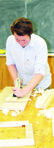 Grade 11 student Duncan McDonald was demonstrating some of the things done in the wood shop.