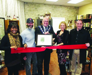Helping with the ribbon cutting at Bolton's Drake Apothecary last Saturday were Councillor Annette Groves, Rob Spence, Mayor Allan Thompson, Michelle Marino Drake and Councillor Rob Mezzapelli. Photo by Mark Pavilons