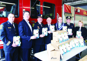 Dufferin - Caledon MPP Sylvia Jones (far right) was joined by Deputy Fire Chief Darryl Bailey, Doug DeRabbie of the Insurance Bureau of Canada, Fire Chief David Forfar, Oxford MPP Ernie Hardeman, Mayor Allan Thompson and Deputy Fire Chief Mark Wallace at Monday's announcement that 100 carbon monoxide detectors had been donated to the Town. Photo by Bill Rea