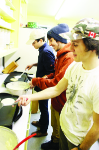 Alton Venturers Alex Newall, Andrew Newall and Colin Villman were handling some of the cooking chores in the kitchen at the Legion hall in Alton.