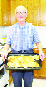 Walter Jungwirth was serving up a big platter of pancakes all ready to be eaten at the dinner at St. John's Church.