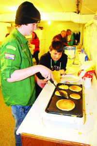 Scouts Tyler Bollinger and Joseph Boccia were working hard to keep up with the demand at Mono Mills United Church.