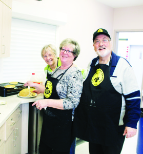 Caledon Seniors' Centre in Bolton had a big crowd out for their celebration. Margaret Hinton, Suzanne Ackers and Doug Ackers were busy on the cooking detail.