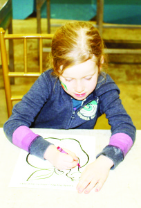 There were crafts for the young folks to work on, and Claire Smith, 5, of Georgetown was busy with her creation.