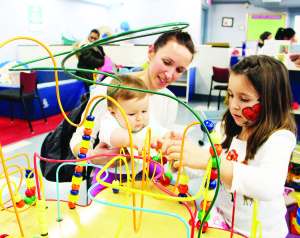 CPCC has lots of great toys, and Sanja Herbst or Bolton was watching as eight-month-old Maja and Aleksandra, 7, gave them a try.