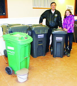 Ricardo Figueroa and his daughter Johanna, 12, of Caledon village were checking out the sizes of bins available at a recent open house at Caledon Village Place. Photo by Bill Rea