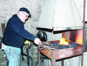 Fire and Ice Festival captivates Alton There was plenty of artistry in evidence last weekend for the sixth annual Fire and Ice Festival at Alton Mill. Blacksmith Ray Schindler was hard at work in the forge. Photos by Bill Rea