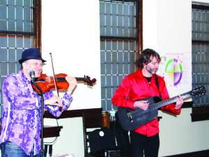 SULTANS OF STRING PERFORM Chris McCool and Kevin Laliberte, members of the Juno Award winning Sultans of String, put on a lively show Sunday night. They were performing at the Parlour Concert at Claude Church on Highway 10. Photo by Bill Rea