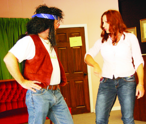 Aging rock star Nathan Pond (Mike Fortin) has a chance to make a mega comeback, but only if his strong-willed agent Cassandra Blue (Tanya Nordin) can keep him from drinking. The scene is from the Inglewood Schoolhouse Performers' production of How Does Your Garden Grow? Photo by Dan O'Reilly