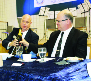 Ken Robinson, representing the Provincial level of the Air Cadet League of Canada, was taking part in the Passing the Port with Mayor Allan Thompson in preparation of the toasts. According to custom, the bottle was not to touch the table until it was either empty or all at the table had been served. Also, since the cadets were involved, the bottle was symbolic, and did not contain alcohol.