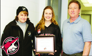 CHARTER COYOTE GETS AWARD Daphne Coulombe has received the Caledon Coyotes first ever Player Appreciation Award for her dedication and commitment to the Caledon Girls Hockey Association (CGHA). Daphne is the first graduating player to have played hockey solely on a Coyotes team since the Association's inception in 2007. Daphne is to be commended on her contribution to hockey in Caledon and for her encouragement of other young girls to join a Coyotes' team. She is a true ambassador. She will be pursuing her studies in business at Western University. Daphne is seen here with CGHA Executive members Sherry Thomas and Bob Symons. Submitted photo