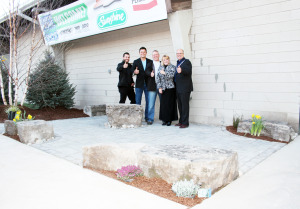 This new landscaped entrance to the arena is the work of SW Stoneworks, in cooperation with Sunshine Landscaping and Permacon. Seen here are Sean Werlick and James Van Stralen of Sunshine, Scott Waldner of SW Stoneworks, Dufferin-Caledon MPP Sylvia Jones and Mayor Allan Thompson.