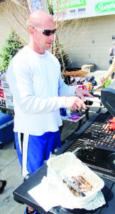 Various community groups had members hard at work barbecuing food for those attending the Show. Rod Karasiak of Palgrave T-Ball was handling some of the cooking chores.