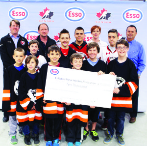 Representatives of Caledon Minor Hockey were on hand recently to accept the cheque for winning the Esso Medals Score Big Contest. Photo by Bill Rea 
