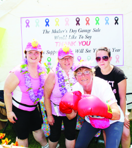 GETTING SERIOUS ABOUT CANCER Kim Bernard even had on boxing gloves as she was surrounded by Cheryl Mills, Martha McLellan and Kayla Faye Saturday at the One Walk Garage and Other Stuff Event. The 11th annual fundraiser for the Princess Margaret Cancer Centre was held on Winston Churchill Boulevard, near Terra Cotta. Photo by Bill Rea