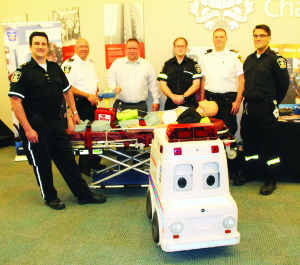 PARAMEDIC WEEK MARKED IN PEEL These paramedics with Peel Region had this display set up last Thursday outside the Regional Council Chambers in recognition of Paramedic Week. Seen here are Chris Bennett, Brad Bowie, Paul Snobelen, Dave Wakely, Joel D'Eath and Brandon Wiedemann. Photo by Bill Rea