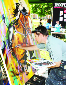 In keeping with the upcoming equestrian events at the Pan Am Games, artist David Arrigo from Hockley Valley was working on this creation at Caledon Day.