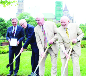 Dr. Mark Kristmanson, Russell Mills, David Tilson and Ken Jewett were taking part in the recent announcement in Ottawa.