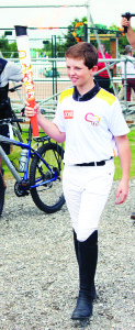 Palgrave area resident Sam Walker carried the Torch out of the equestrian facility in Palgrave.