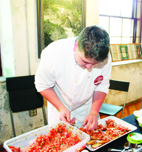 The annual Cuisine-Art Festival brought crowds out over the weekend to Alton Mill Arts Centre. Conner Douglas, of Edge Wine Bar in Orangeville, was preparing bruschetta with Woolwich goat cheese and balsamic reduction. Photos by Bill Rea