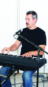 Alton area resident Lou Pinto was providing piano music Saturday.
