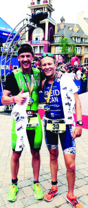 Lionel Sanders in Green and Taylor Reid in Kinetico Blue at the finishing line of Mt. Tremblant.