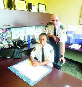CHIEF FOR A DAY Tarnpreet Saroya, a Grade 5 student at Caledon Central Public School, is interested in being a police officer when she grows up, and she was able to get a taste for the job recently. Tarnpreet, 11, was named Chief for the Day of Caledon OPP and Inspector Tim Melanson was happy to relinquish his spot as detachment commander. There were 43 young people who submitted essays explaining why they should be chosen, and Tarnpreet said she wrote about her hobbies, and why she thought she should be chosen. “I'm confident, I'm hardworking and responsible,” she said, adding she wrote on behalf of her twin sister Tarleen, who didn't want to compete against her. “I really like the job and I think it's cool to be a police officer.” Photo by Bill Rea
