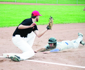 Bolton's Tysen Hansen slides head first into third base against Nobleton Saturday. The Dodgers beat the Cornhuskers 12-3. Photo by Jake Courtepatte