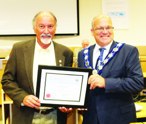 VILLANOVICH IS SENIOR OF THE YEAR At its June 23 meeting, Caledon council presented long-time Bolton resident Aldo Villanovich with the 2015 Senior of the Year Award. “It was an honour for me today to present the 2015 Senior Citizen of the Year award to a very deserving resident of Caledon and great Canadian, Aldo Villanovich,” said Mayor Allan Thompson. “Aldo is a shining example of compassion, kindness and community stewardship that reaches well beyond our borders.” Villanovich has championed many organizations, charities and community projects within Caledon and beyond, including Bolton Hockey Executive, Kinsmen Club of Bolton, Cystic Fibrosis Association, Rick Hansen Run, Santa Claus Parade Committee, Bolton Rib Fest, Peace Park, Bus Shelters, Highway 50 Planters, etc. He also worked on many global charities and projects, including water and sanitation projects in Guatemala, Haiti and Honduras; Upgrades for 13 schools in Guatemala; First Nations bunkbed project; Sleeping Children Around the World (to end the spread of Malaria); hospital equipment sent to Belize, Polio Plus, etc. Photo by Bill Rea