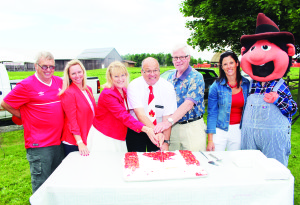 The fun at Downey's Farm Market Canada Day Strawberry Festival  included this ceremonial birthday cake for Canada. On hand for the official cutting were Councillors Gord McClure and Jennifer Innis, Dufferin-Caledon MPP Sylvia Jones, Mayor Allan Thompson, Dufferin-Caledon MP David Tilson, Councillor Johanna Downey and Dudley, the Downeys' mascot.