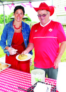The festivities started early at Downey's Canada Day with the annual pancake breakfast. Councillors Johanna Downey and Gord McClure were hard at work on the serving line.