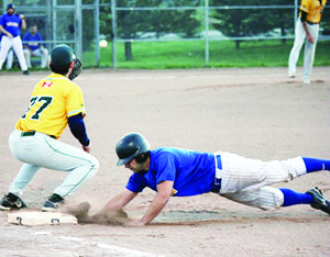 Brett Chater slides safely into first base during an attempted pickoff when the Bolton Brewers played the Newmarket Hawks last week. The Brewers rallied in the seventh to win the game 6-5. Photo by Jake Courtepatte