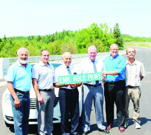 Signs like this one will soon be marking Emil Kolb Parkway. Joining Kolb for Tuesday;s celebration were Brampton Councillor John Sprovieri, Caledon Councillor Rob Mezzapelli, Peel Regional Chair Frank Dale, Mayor Allan Thompson and Caledon Councillor Nick deBoer. Photo by Bill Rea