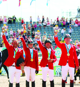 Yann Candele, Tiffany Foster, Eric Lamaze and “Captain Canada” Ian Millar waved to the crowd with their new gold medals around their necks.