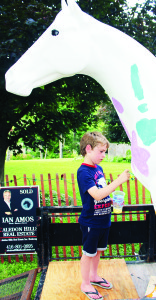 In keeping with the equestrian mood going on during the Pan Am Games, Cheltenham Day included a horse there for the decorating. Henry Judge, 6, of Cheltenham was making his contribution.