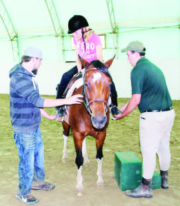  Nicole Miasik, 12, of Etobicoke, was getting assistance mounting Mira from counsellor Martin Nash and coach Cameron Scheffler.