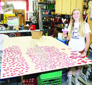 Ginny McAllister has a wide assortment of Canadian pins she's planning to distribute to people she meets in Poland.