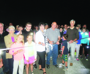 There was a large crowd of people out for an evening stroll along the main runway at Brampton Flight Centre. The event was the second annual Light Up the Runway Walk, in support of Bethell Hospice. Mayor Allan Thompson and his wife Anne were there to cut the ribbon to start the walk.